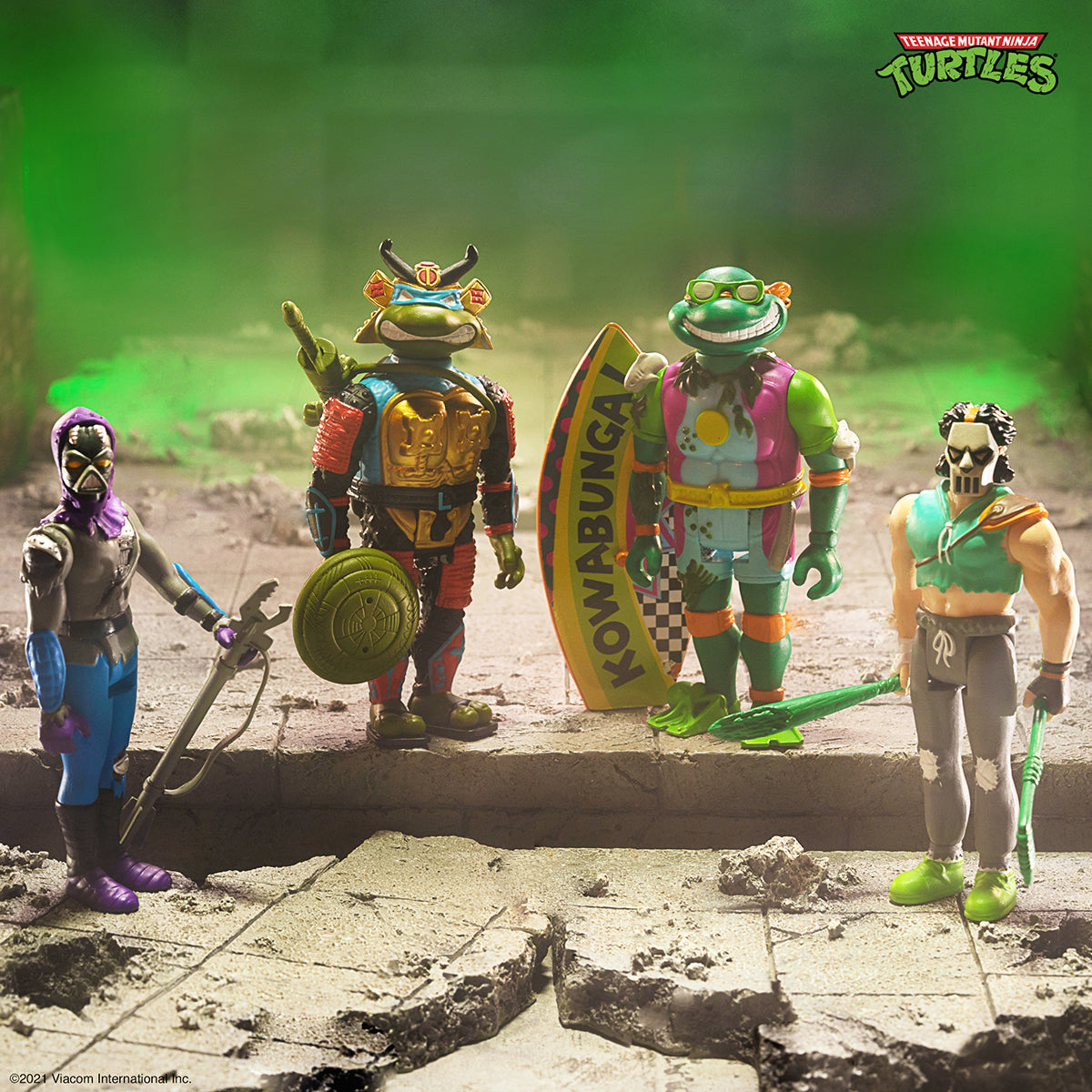 New Teenage Mutant Ninja Turtles Wave 3 ReAction figures posed on a rocky diorama with a green backdrop.