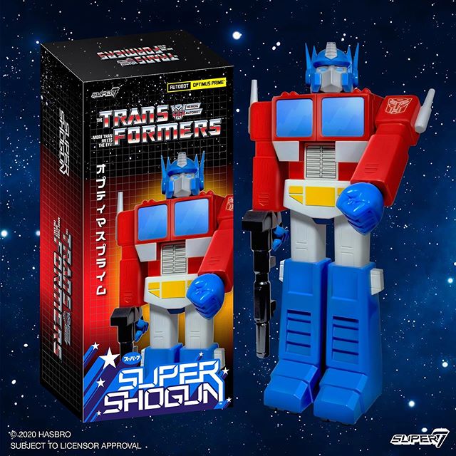 Transformers Super7 Optimus Prime figure with its box against a starry space backdrop.