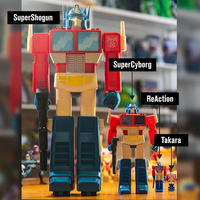 Oversized Super Shogun Optimus Prime with smaller Takara and ReAction figures on display.