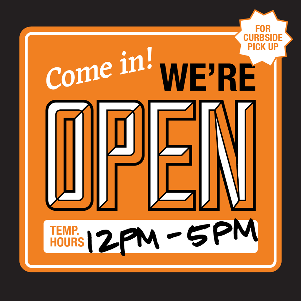 Orange storefront sign reading Come in! WE'RE OPEN with curbside pickup badge and hours 12PM-5PM