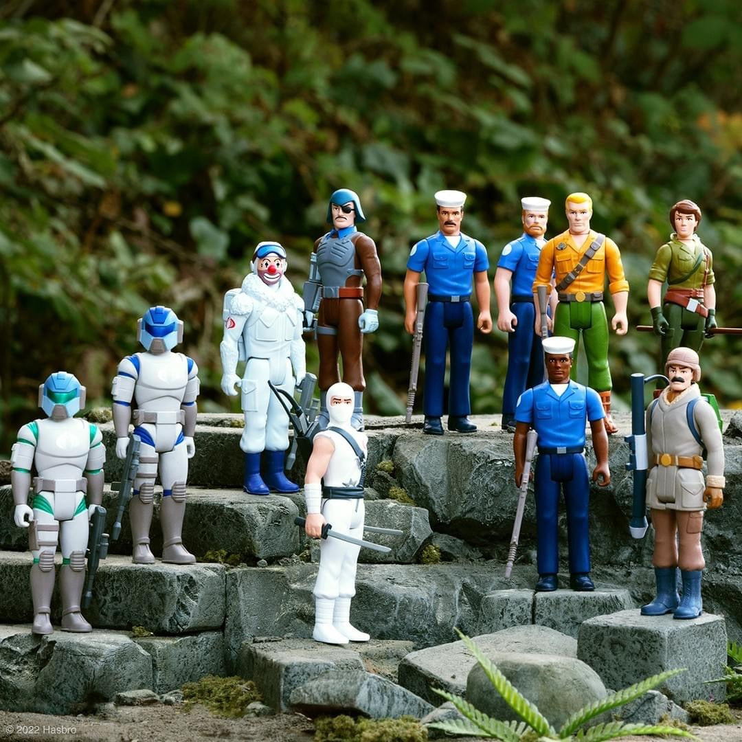 G I Joe Wave 2 ReAction figures arranged on stone steps outdoors.