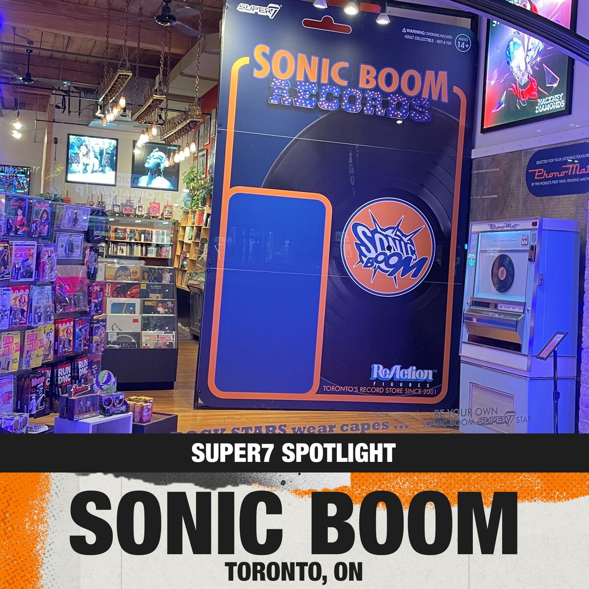 Inside Toronto's Sonic Boom Records, a bold blue and orange display panel with Sonic Boom logo and rows of vinyl records.