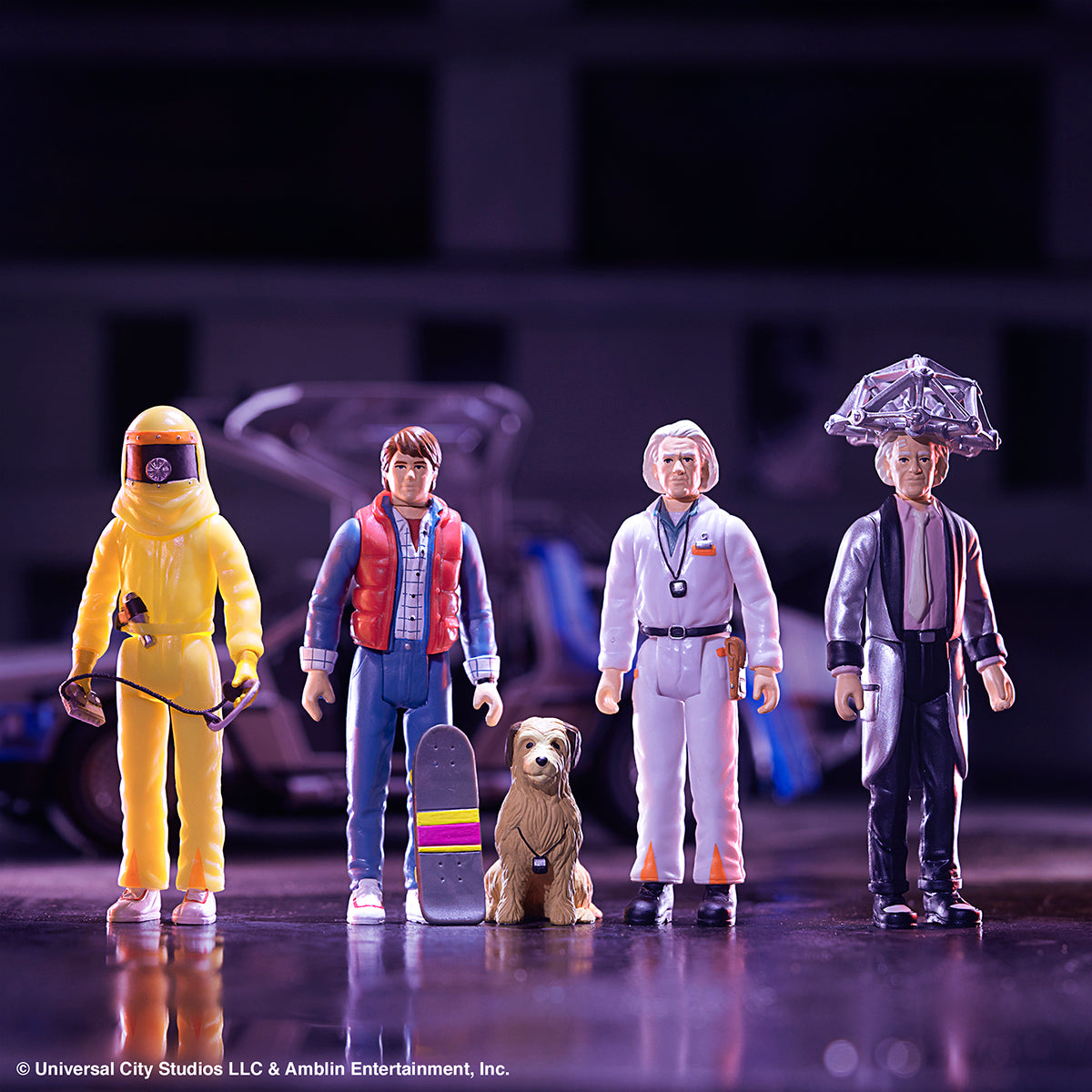 Group of Super7 Back to the Future II action figures including Marty McFly Doc Brown a yellow hazmat suit figure and Einstein the dog