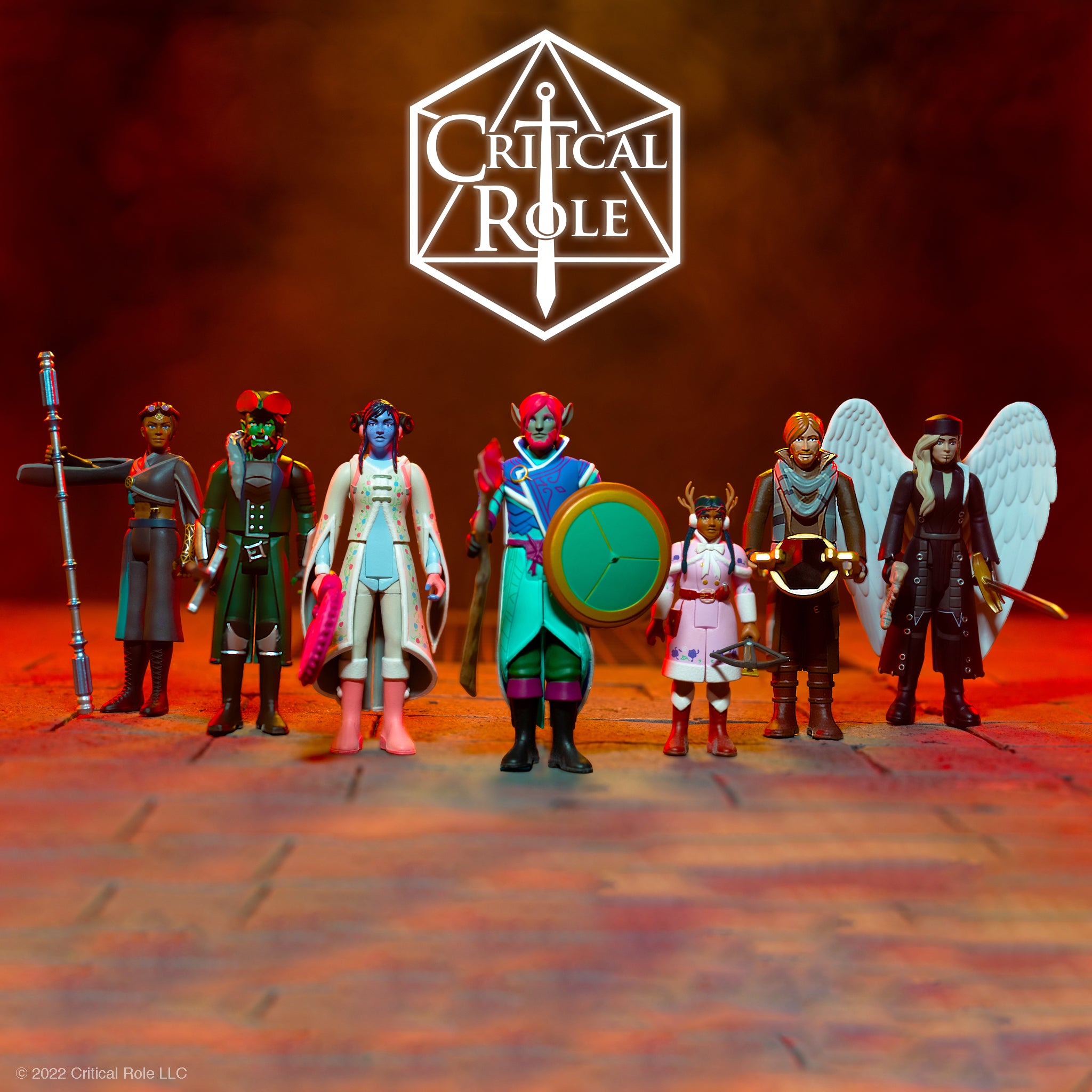Group of Critical Role action figures posed on a stage beneath a large white Critical Role logo.