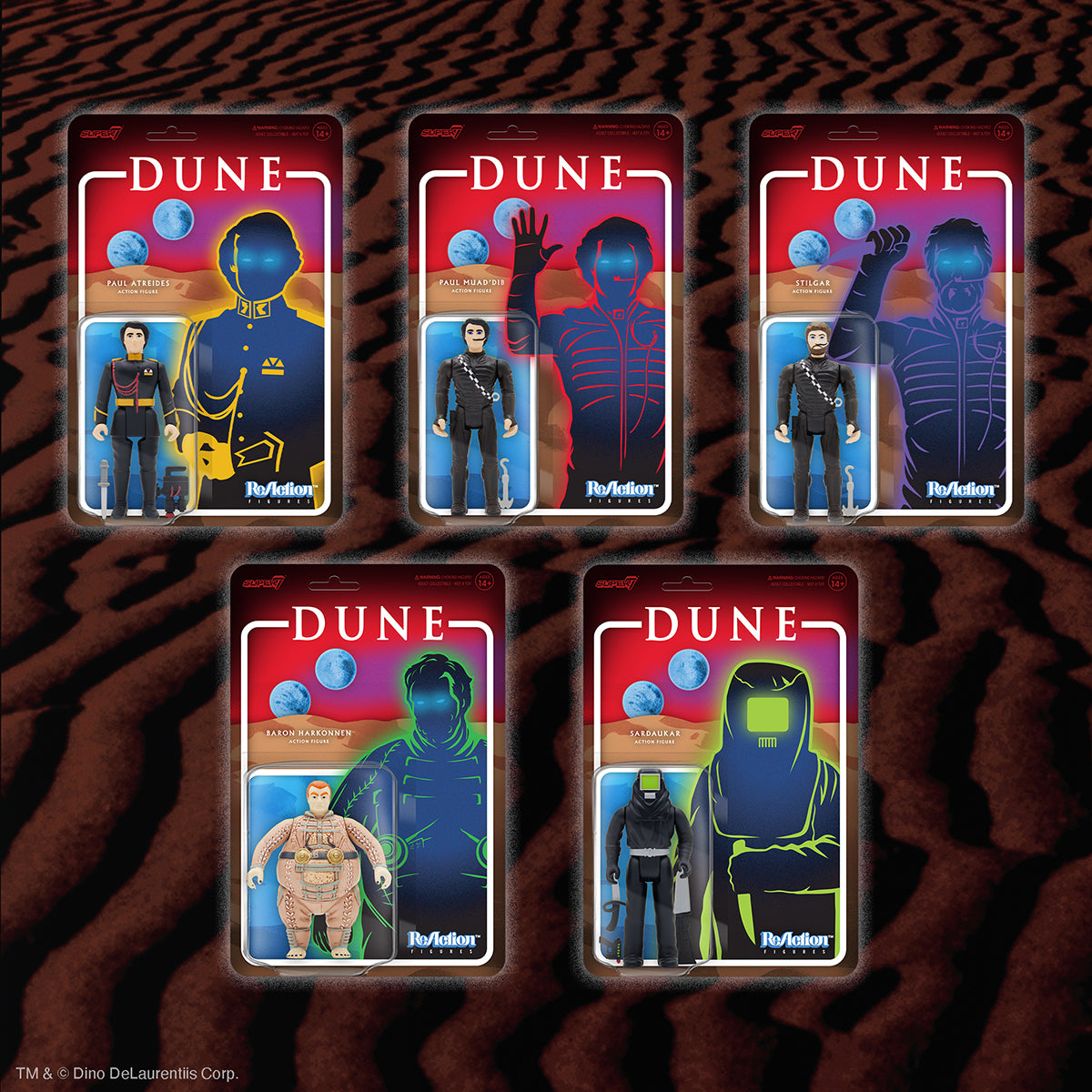 Five Dune ReAction figure packaging cards arranged on a tiger stripe background.