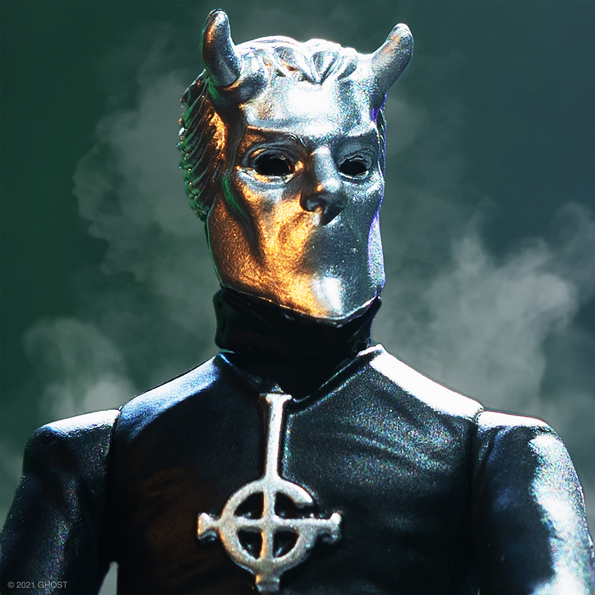 Close-up of a metallic horned mask figure in a black suit with a cross pendant from The Super7 Ghost collaboration