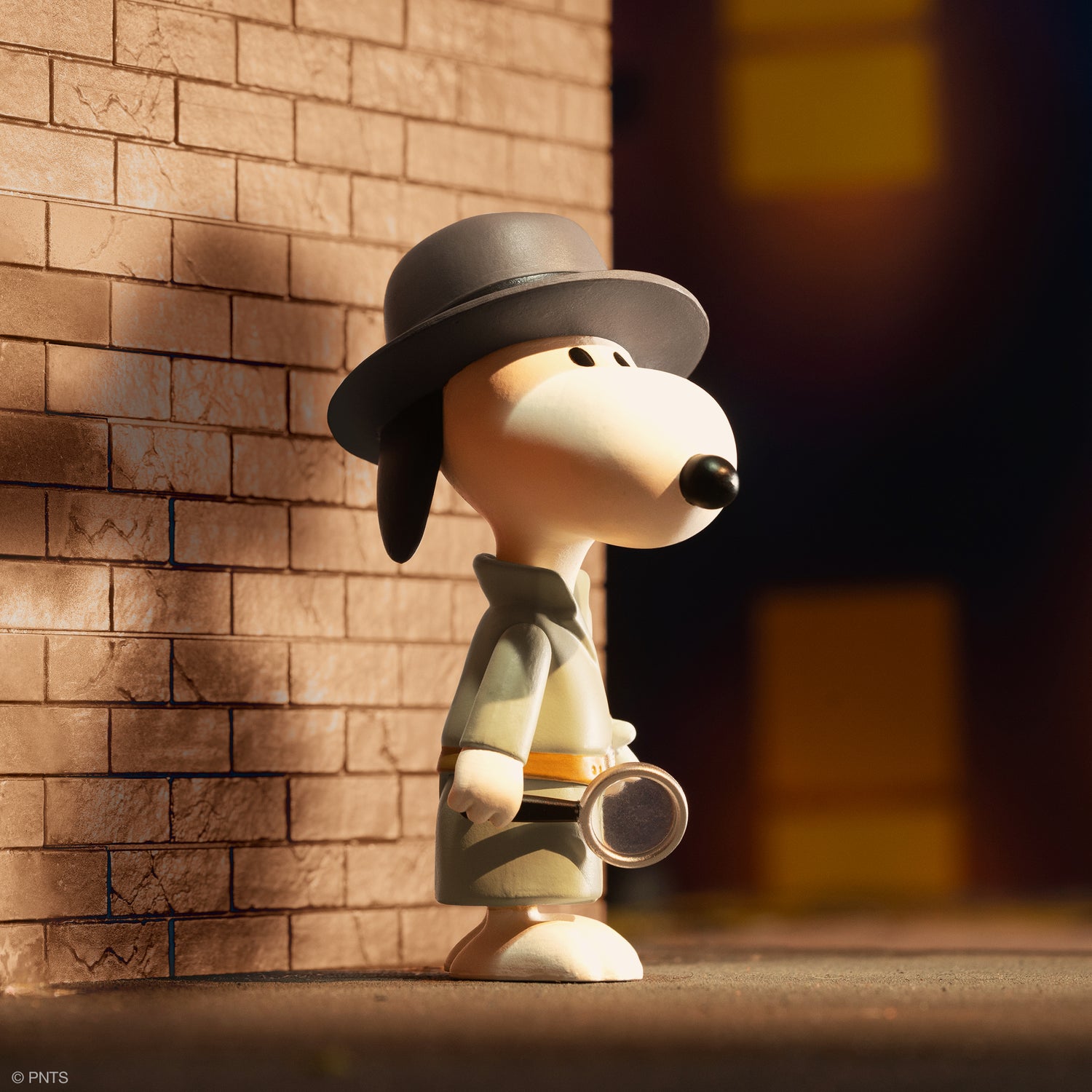 Peanuts Wave 5 ReAction figure wearing a gray top hat stands beside a brick wall backdrop.