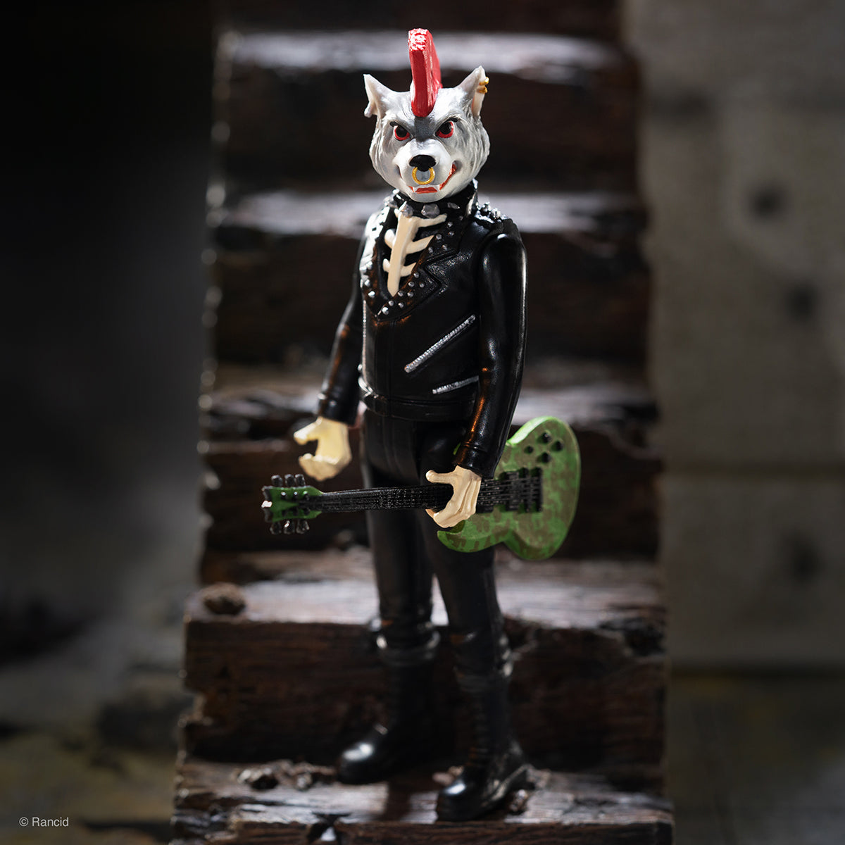 Werewolf rocker action figure in a black leather jacket holding a green guitar