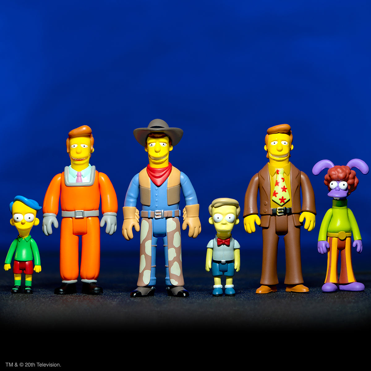 Six Simpsons style ReAction figures stand in a row against a solid blue background.