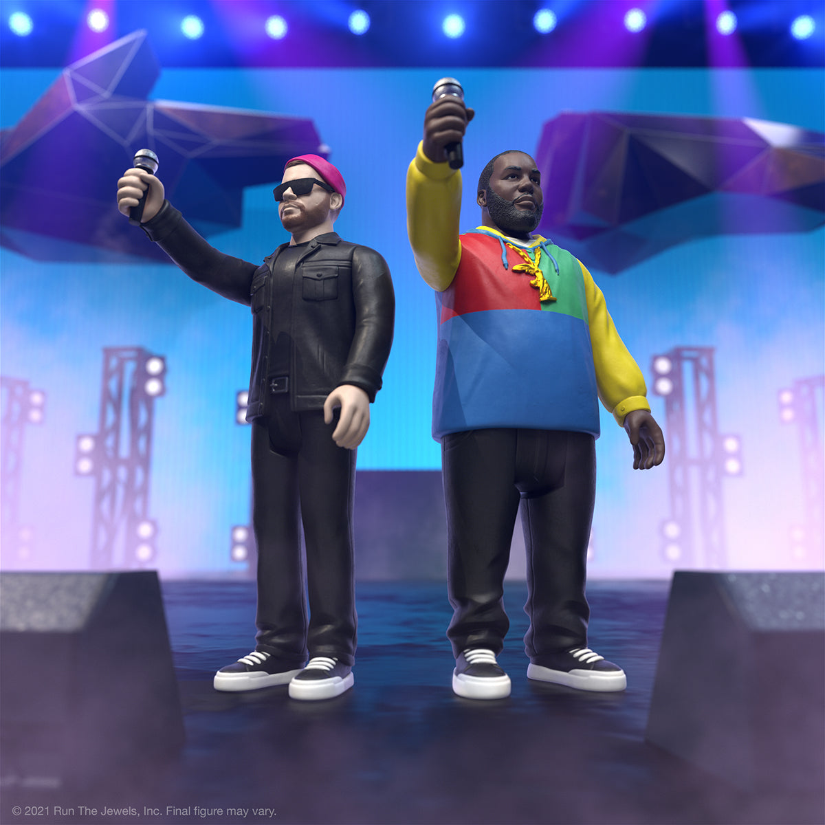 Run The Jewels ReAction Figures posed on a concert stage with microphones and colorful blue stage lights