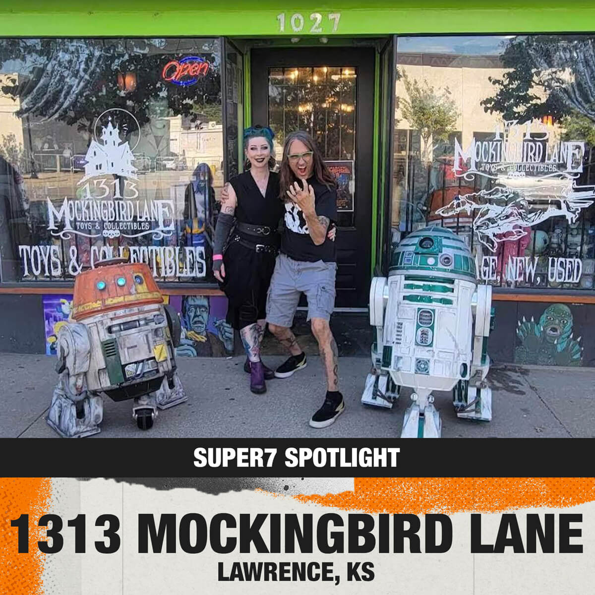 Outside 1313 Mockingbird Lane Toys and Collectibles in Lawrence Kansas, two people posing with R2-D2 and another droid.