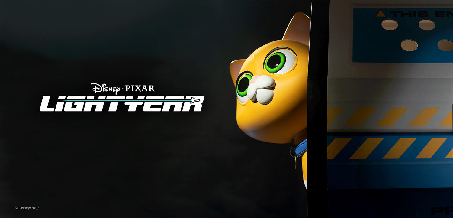 Yellow cat peeks from behind a vertical panel beside the Disney Pixar Lightyear logo