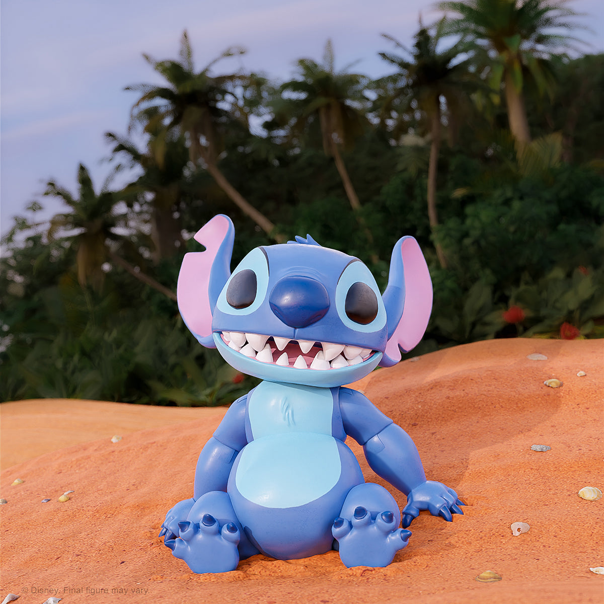 Stitch action figure from Lilo & Stitch perched on orange sand with tropical plants in the background