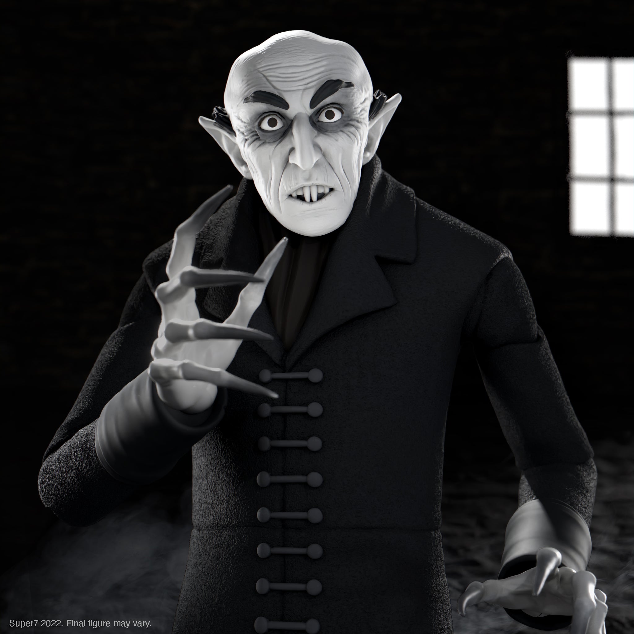 Pale vampire action figure with pronounced fangs and black cape against a dark background.