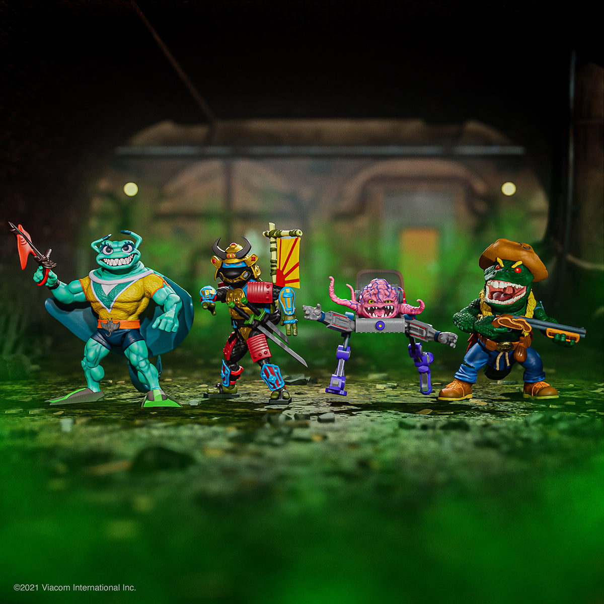 Four TMNT ULTIMATES Wave 5 figures arranged in a dynamic group shot on a studio green backdrop.