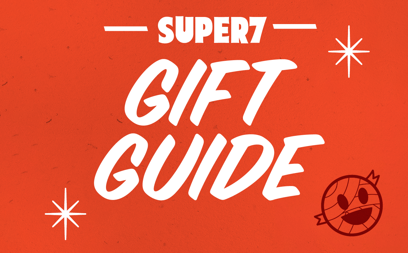 Super7 Gift Guide cover on an orange background with bold white text and a small round cartoon character in the corner.