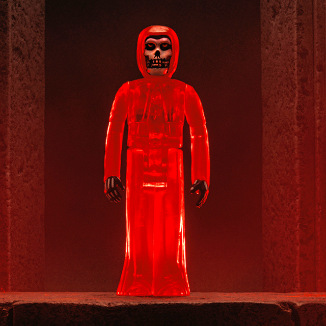 Red translucent hooded Misfits Legacy of Brutality ReAction figure with skull face on display.