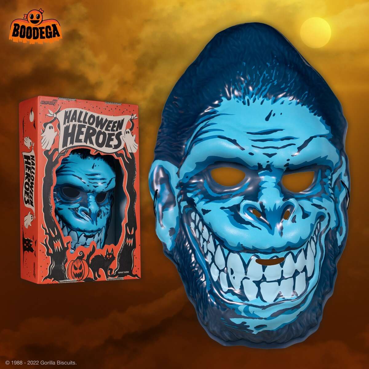 Blue gorilla head mask from Gorilla Biscuits Halloween Heroes set beside a red box