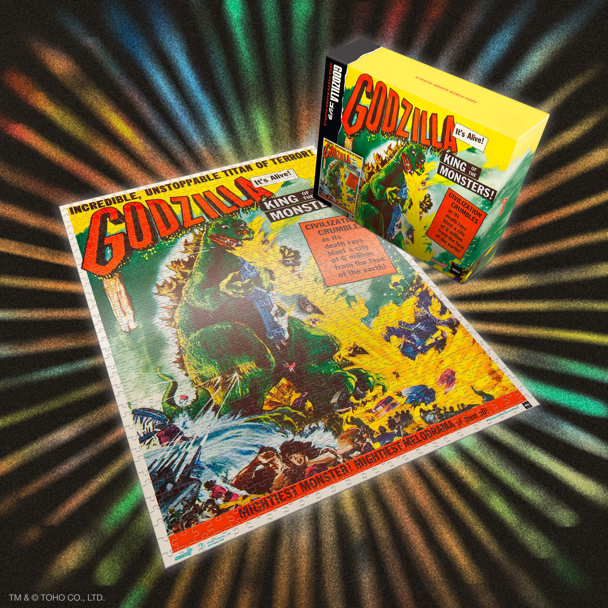 Colorful Godzilla puzzle box with a completed puzzle featuring vintage monster artwork.