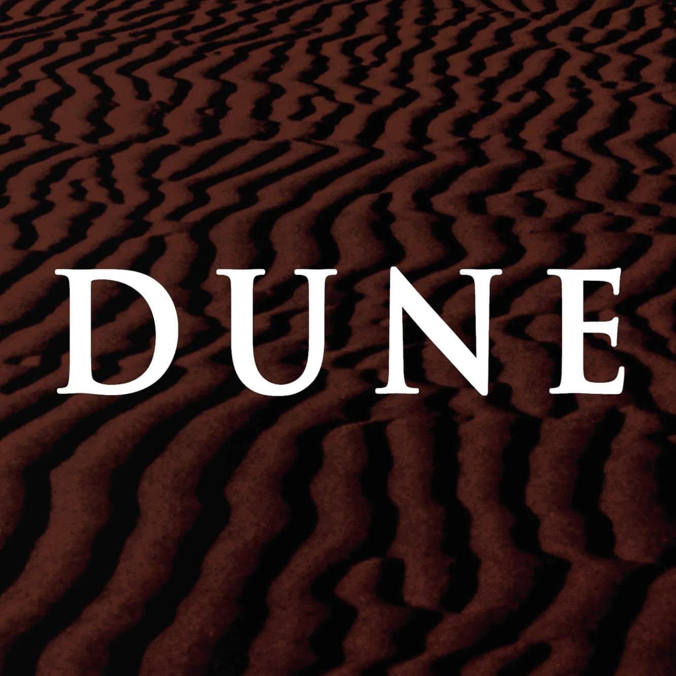 DUNE collection cover with bold white title over a textured red desert dune background.
