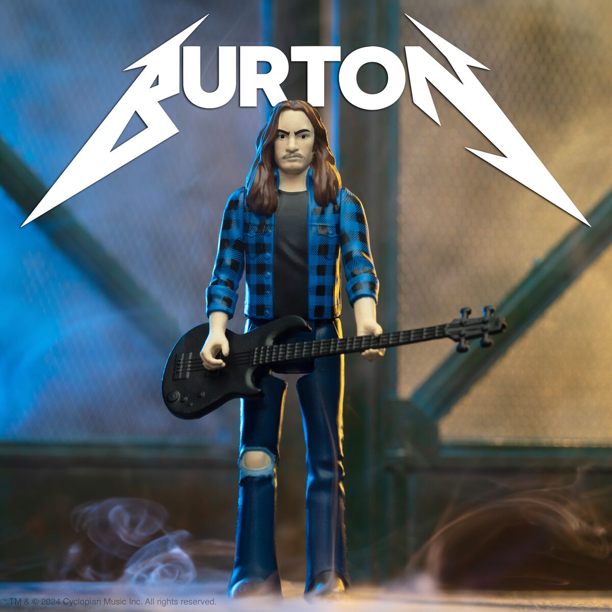 Cliff Burton action figure standing on a stage with a bass guitar, wearing a blue plaid shirt and ripped jeans.