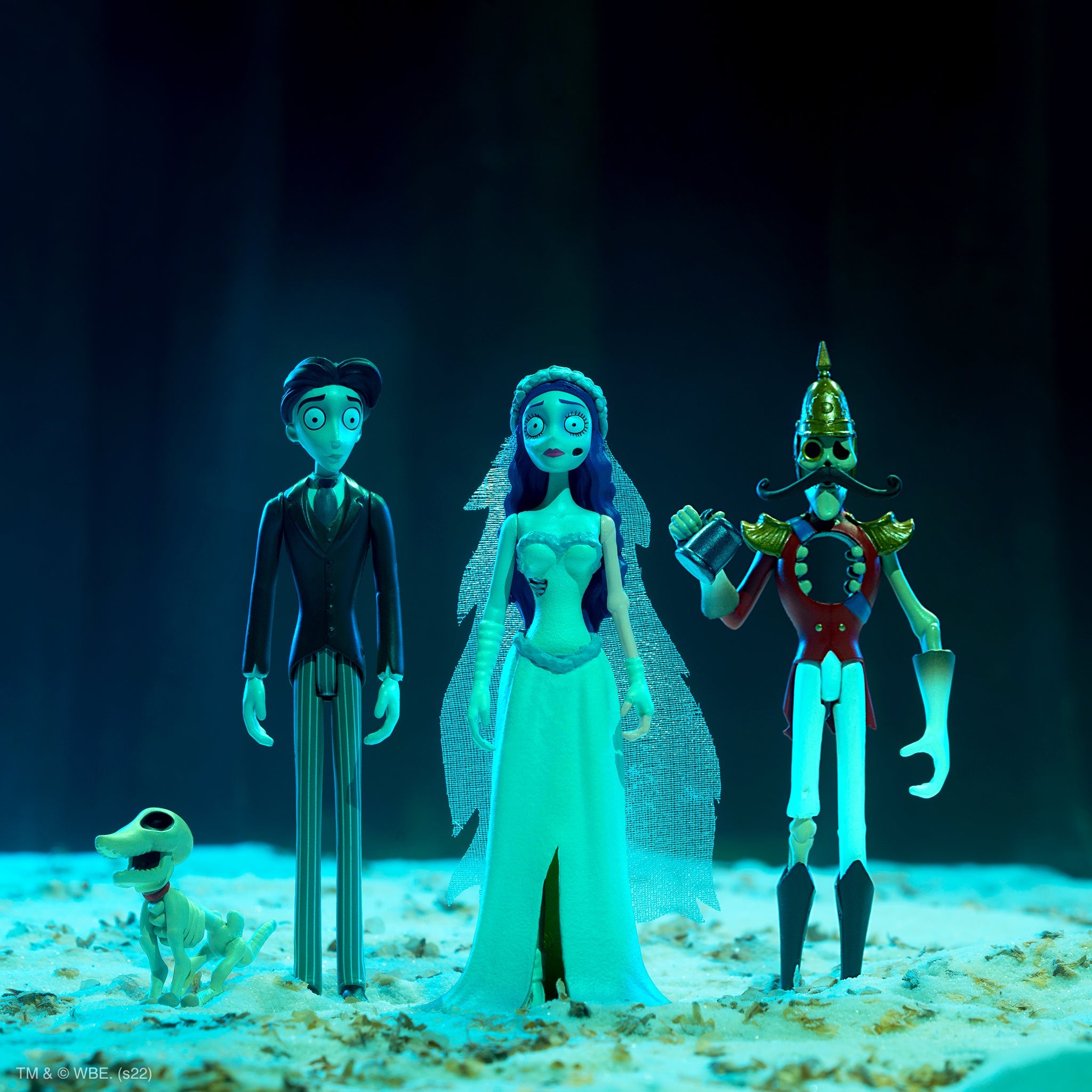 Tim Burtons Corpse Bride character figures arranged under blue stage lighting
