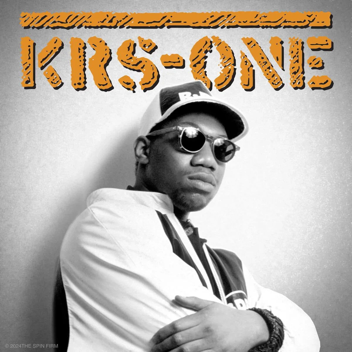 KRS-One portrait on a gray album cover with bold orange KRS-One text across the top.