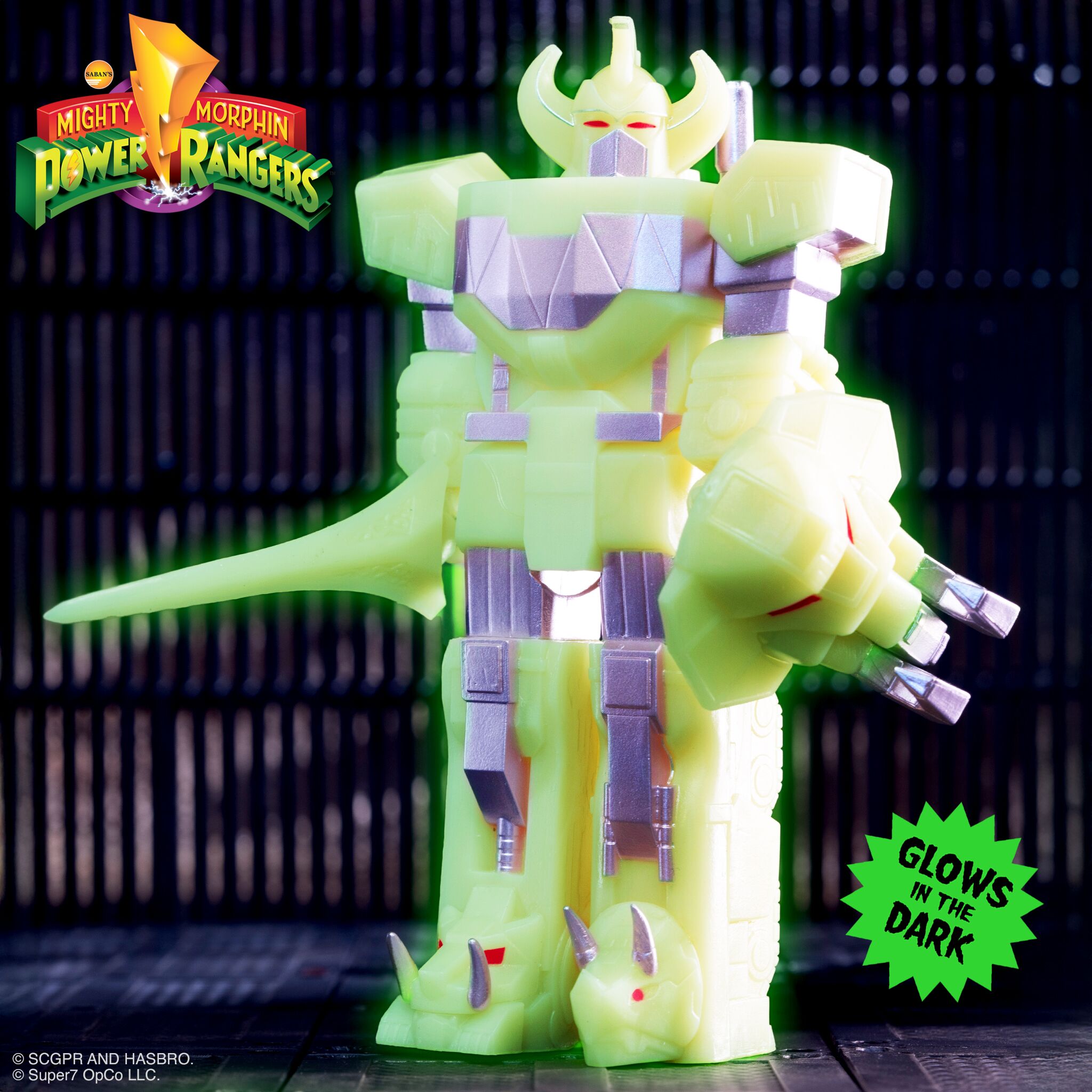 Neon lime Mighty Morphin Power Rangers action figure glowing in the dark wearing armor and helmet and wielding a long weapon against a dark backdrop
