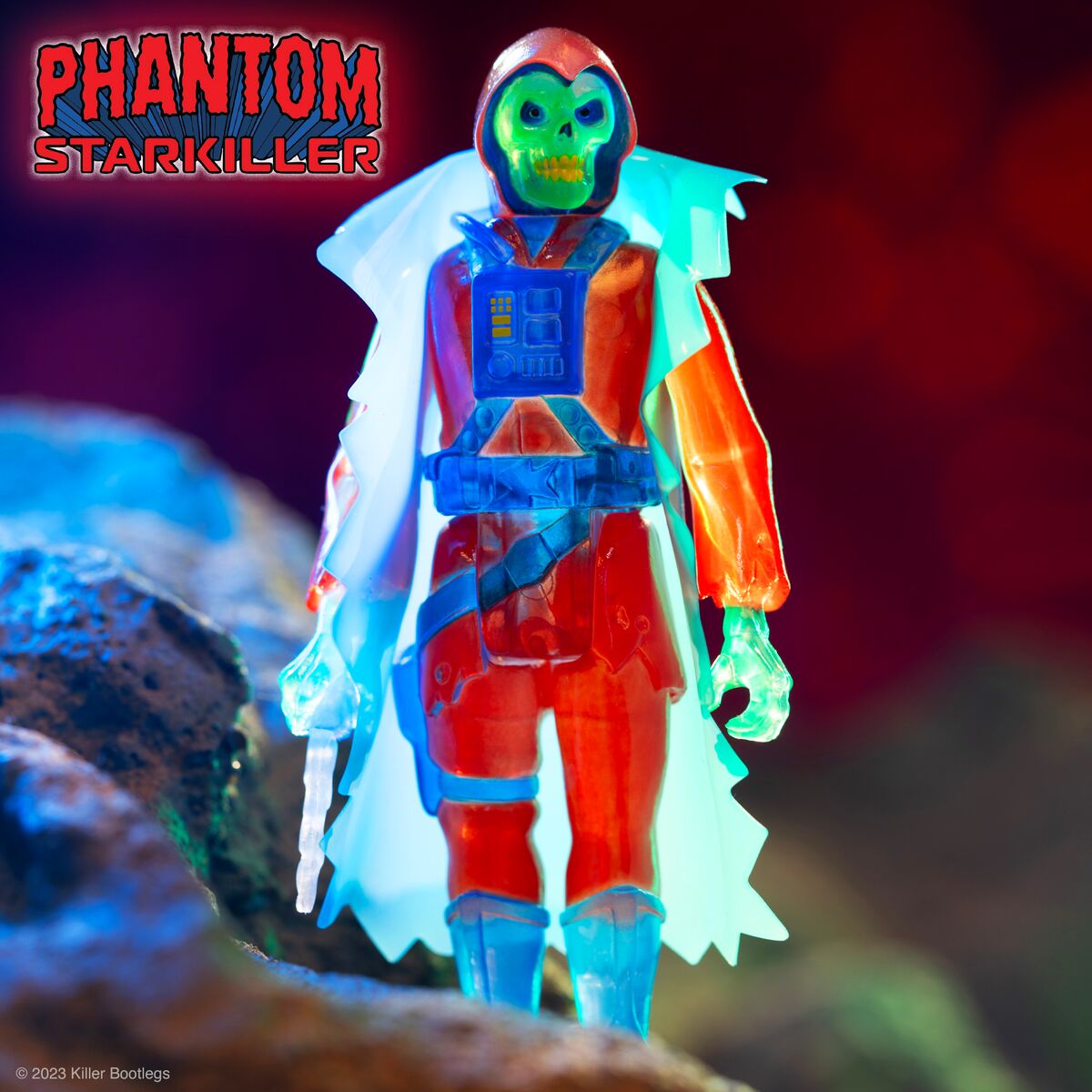 Phantom Starkiller action figure with green skull head wearing a red suit and blue cape under neon lighting