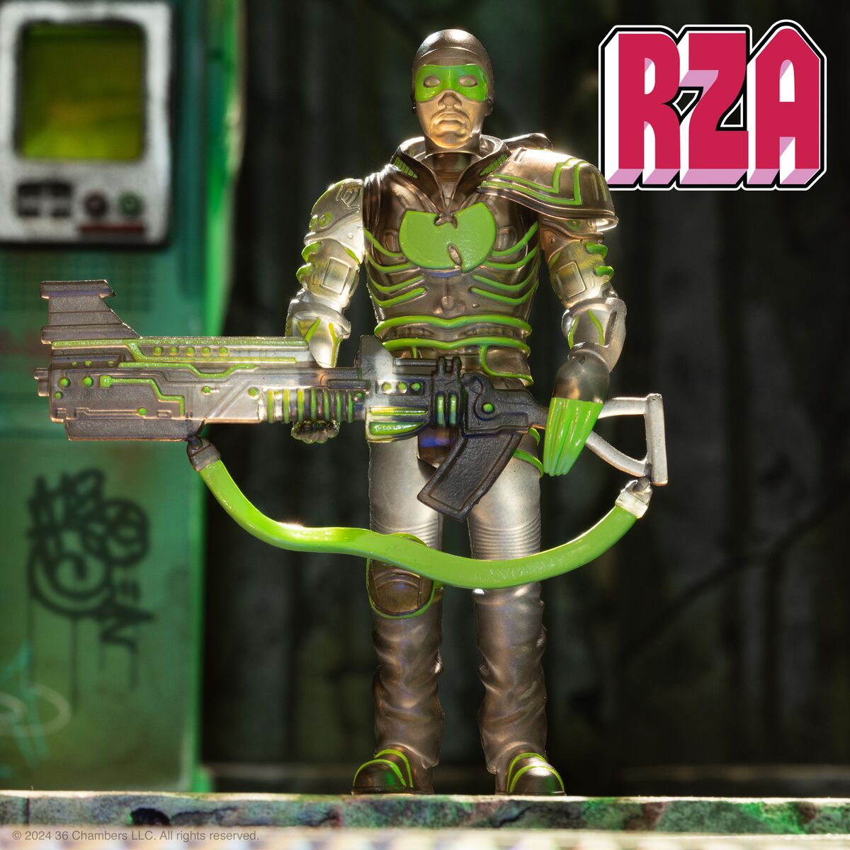 RZA action figure in silver green armor holding a large futuristic rifle stands in a graffiti covered urban alley with a bold RZA logo in the corner.