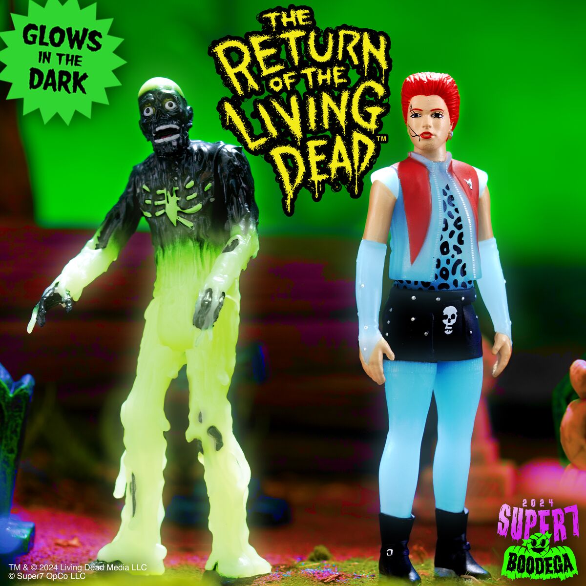 The Return of the Living Dead two figure set with a glowing zombie and a punk rocker against a neon green backdrop