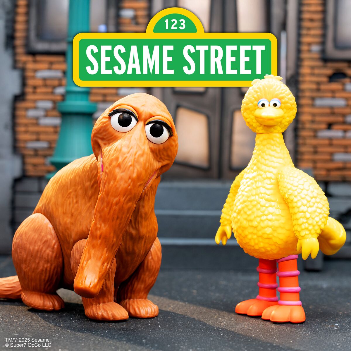 Sesame Street toy set featuring an orange dog and a yellow bird in front of a Sesame Street sign