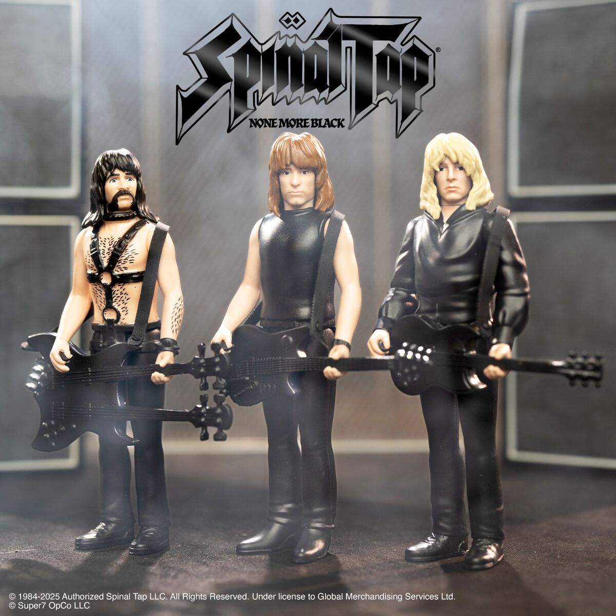 Spinal Tap action figures with guitars posed in a black leather band lineup