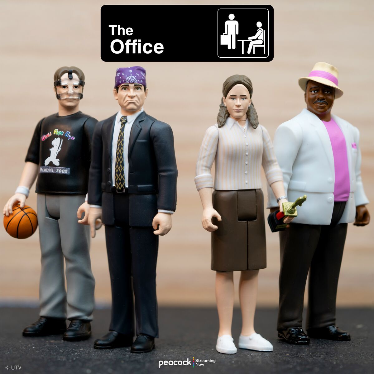 The Office action figure set with four characters and the The Office logo above