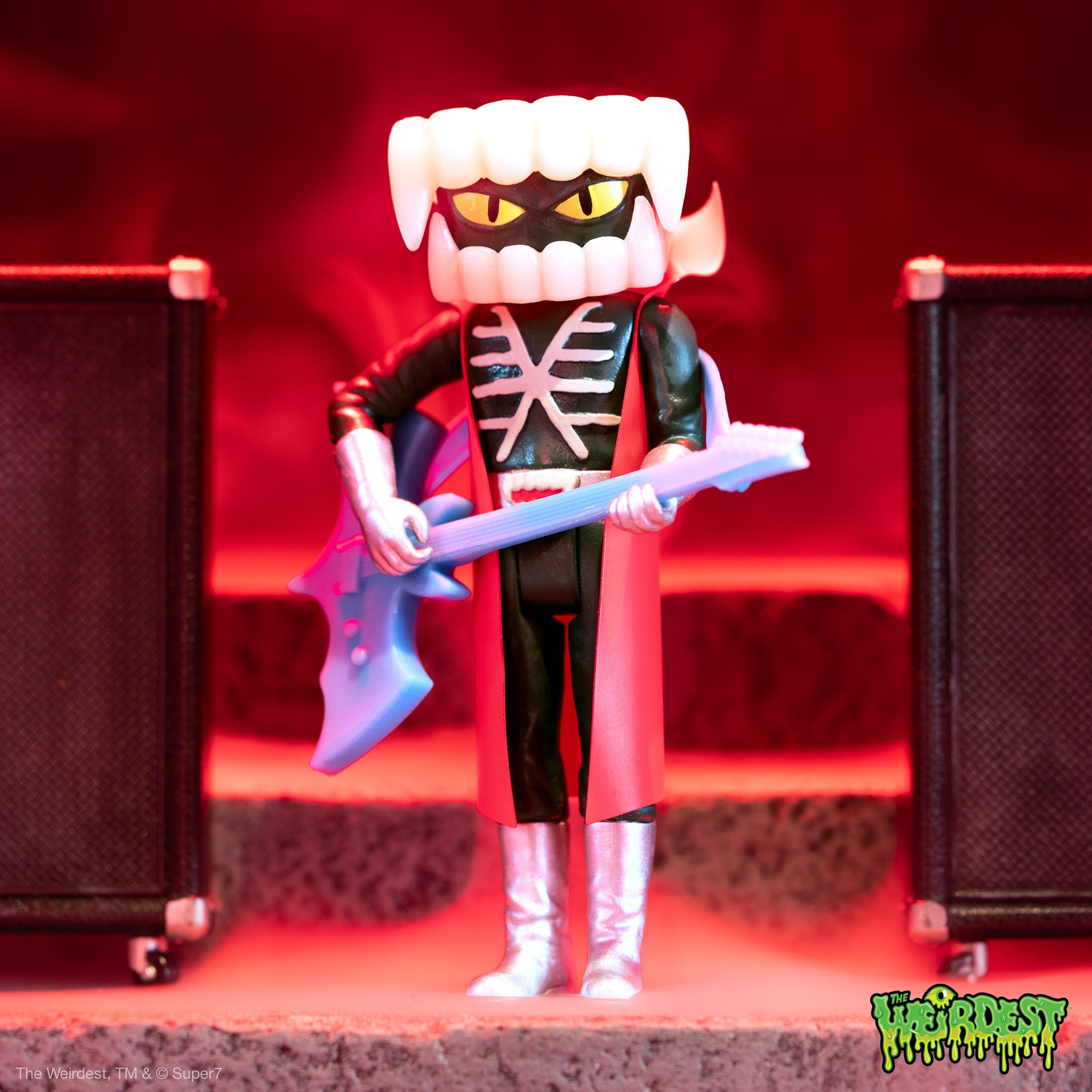Boodega Warehouse Finds display featuring a Godzilla style figure with skeleton ribcage chest holding a blue guitar in a red lit scene