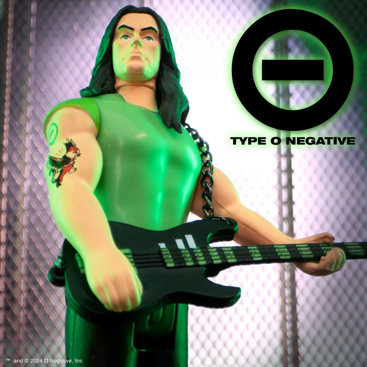 Green monster action figure with long black hair playing a bass guitar beside the Type O Negative logo.