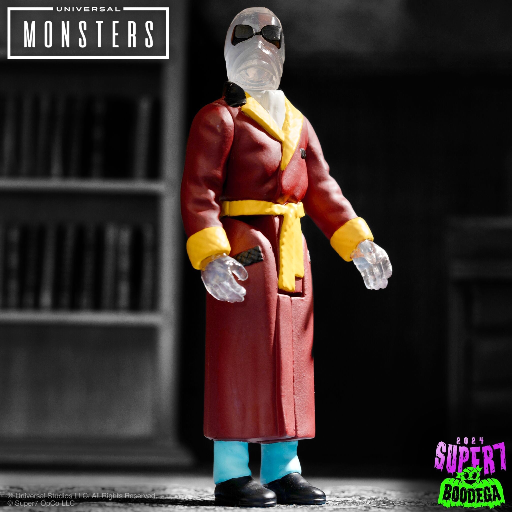 Universal Monsters horror action figure in a red and yellow suit posed against a high contrast black and white backdrop with the logo