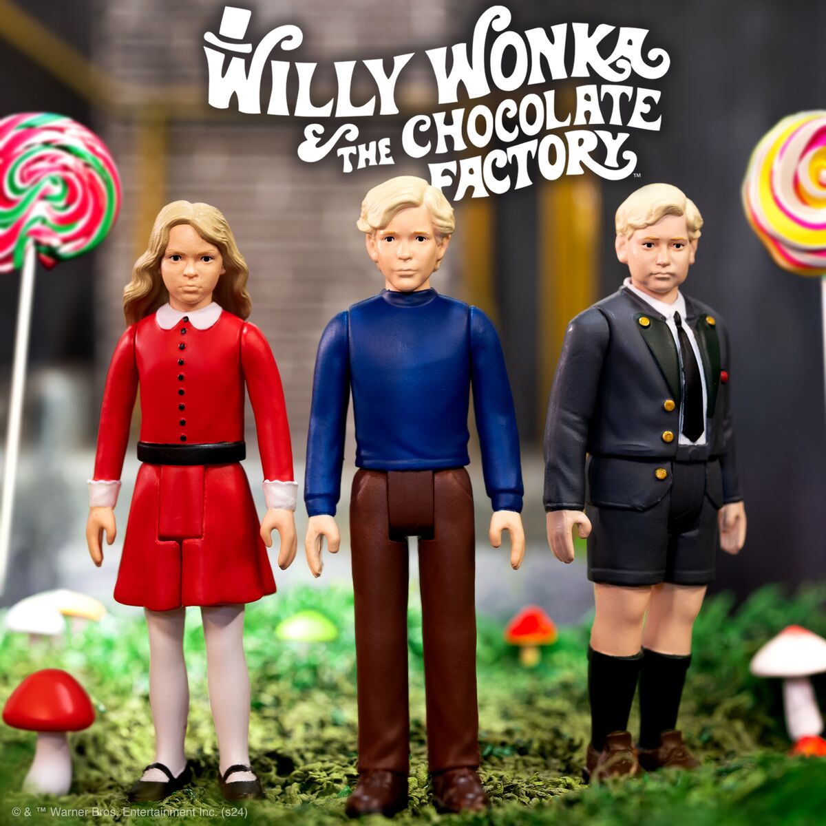 Three Willy Wonka the Chocolate Factory collectible figures stand in a candy garden scene.