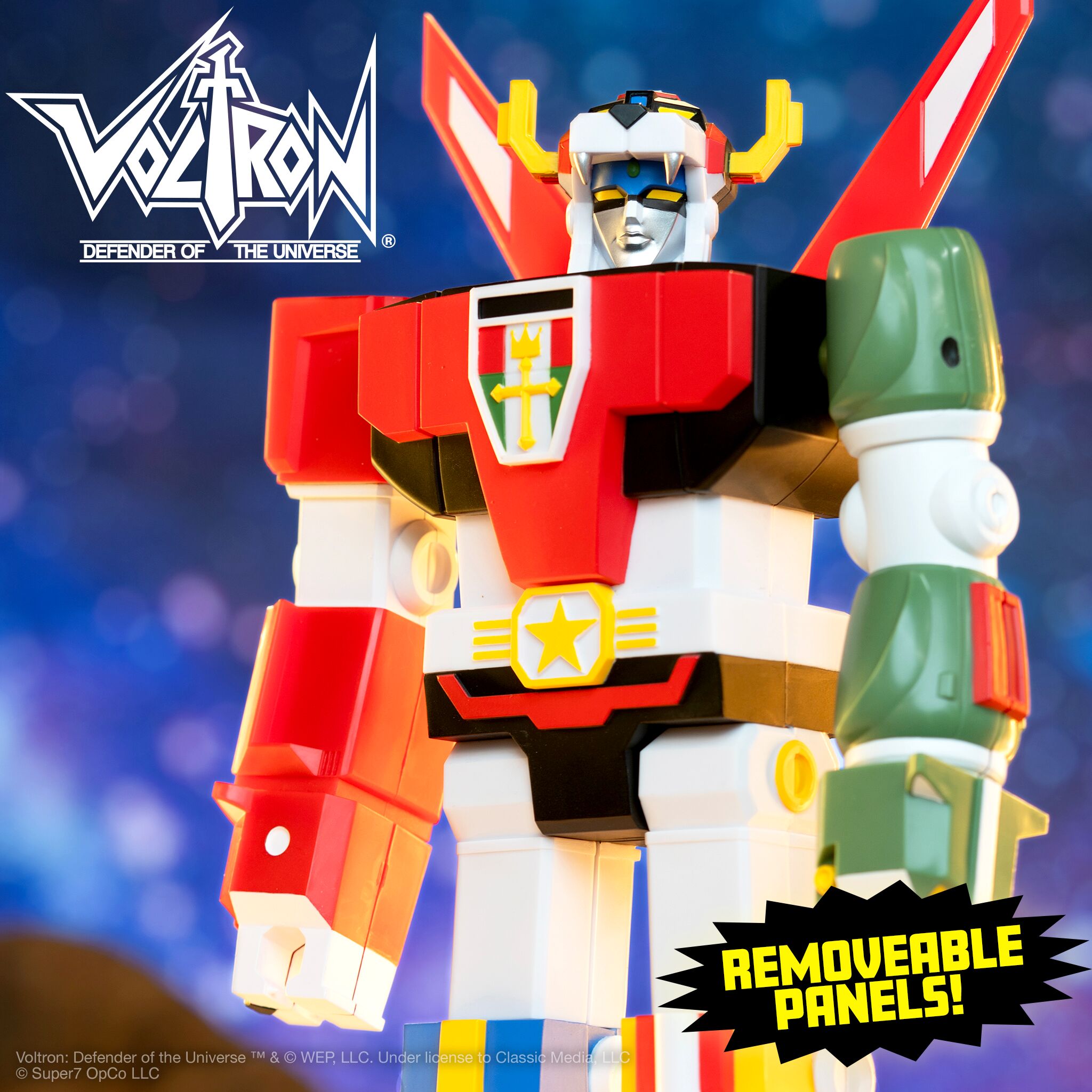Voltron action figure from the Defender of the Universe standing on rocky ground against a blue background.