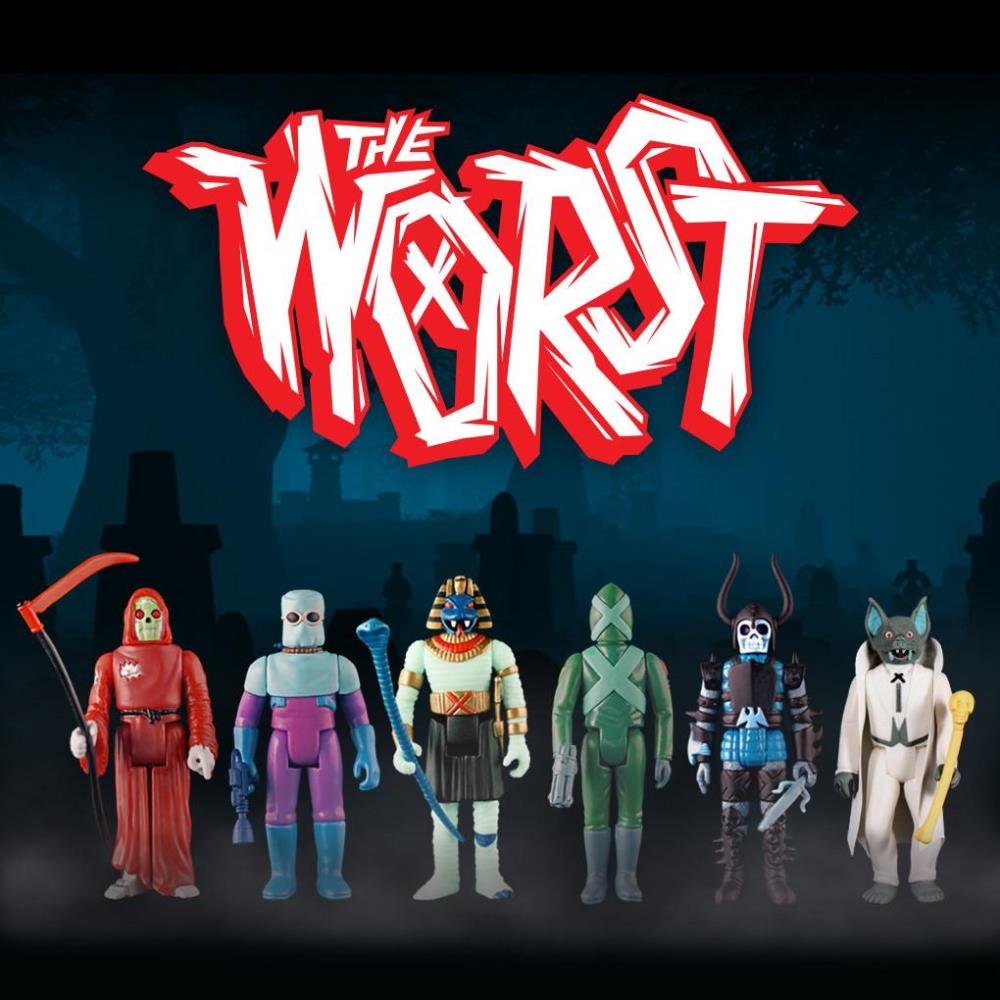 The Worst action figure lineup featuring six colorful monsters posed against a dark cemetery backdrop