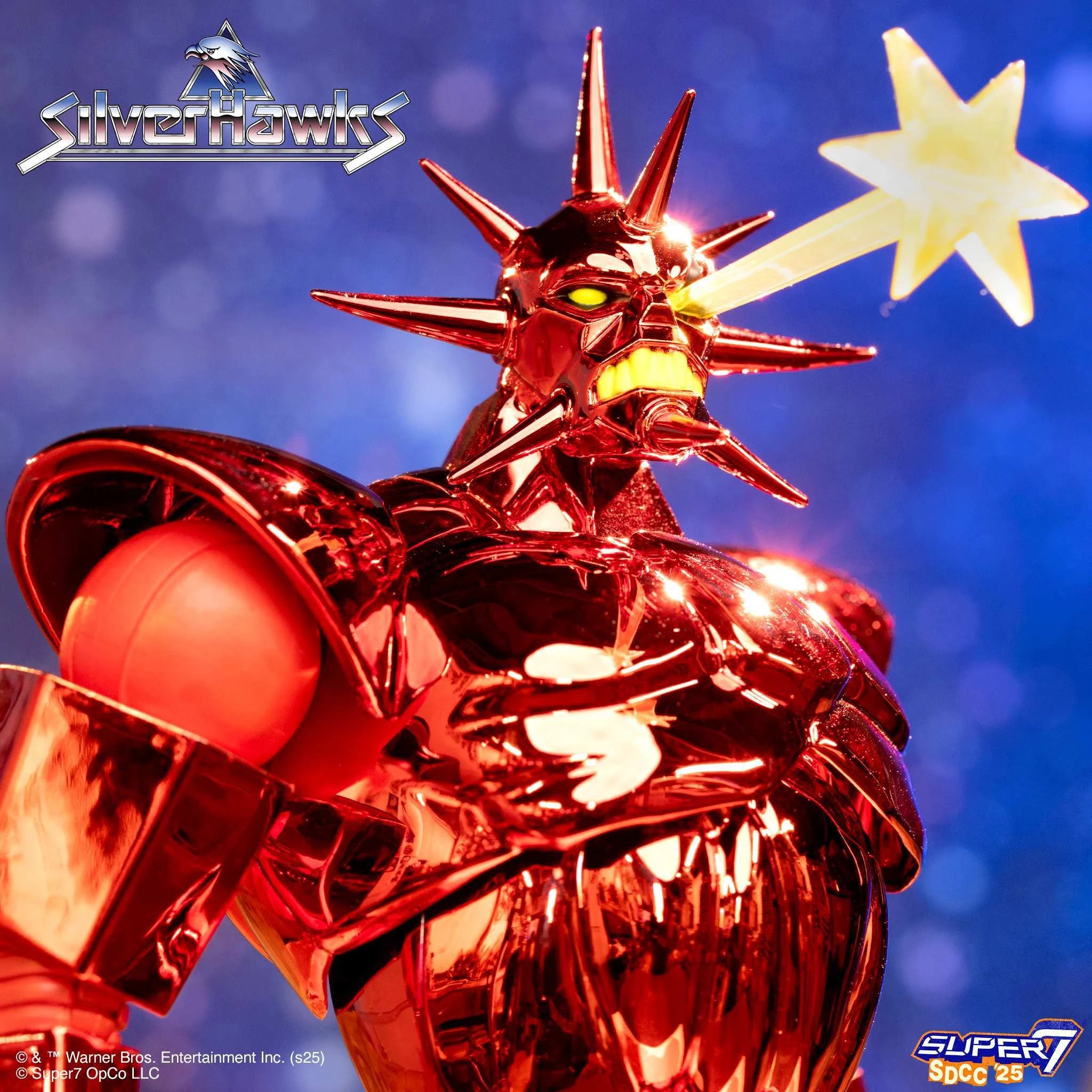 Red chrome SilverHawks Ultimates action figure with yellow horns and blue face against a blue sky.