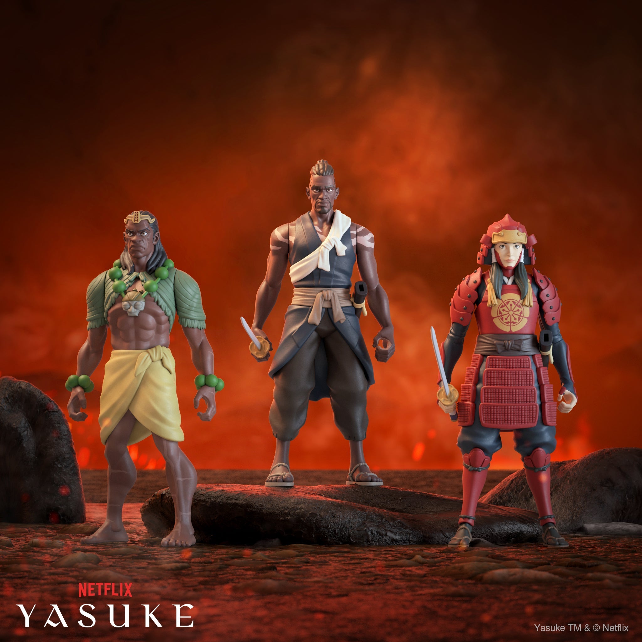 Three anime style action figures stand on a rocky lava ground against a fiery orange backdrop; center figure wears gray with a white sash, flanked by a green bead adorned warrior on the left and a red armored fighter on the right.