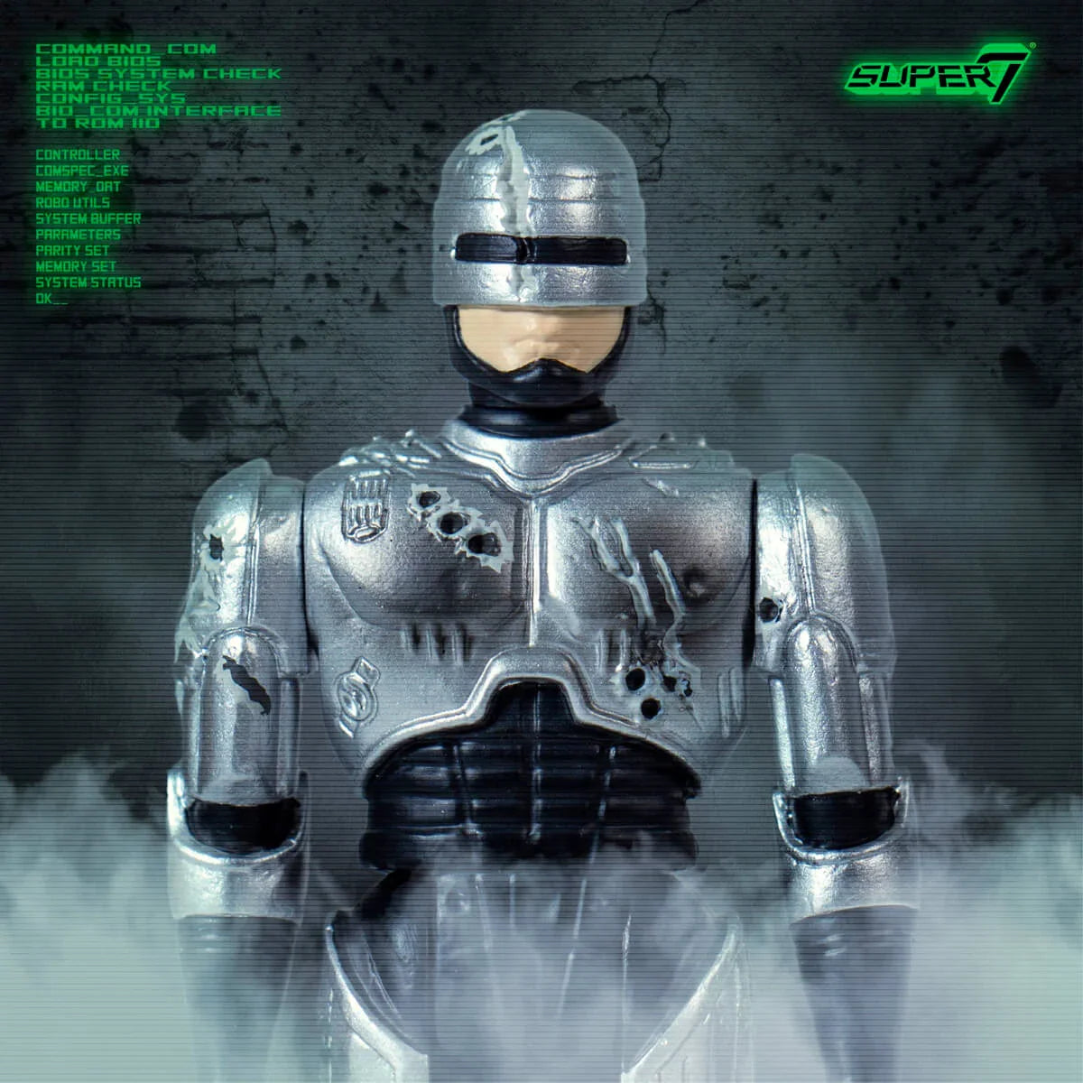 Robocop action figure in silver armor stands amid fog with a futuristic backdrop.