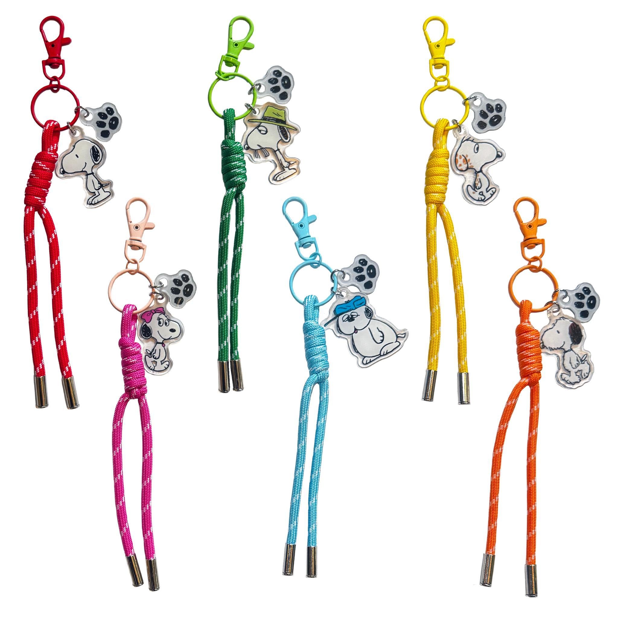 Peanuts Bag Charm Blind Box Wave 01 Siblings set featuring Snoopy and paw print charms on red green and yellow braided cords