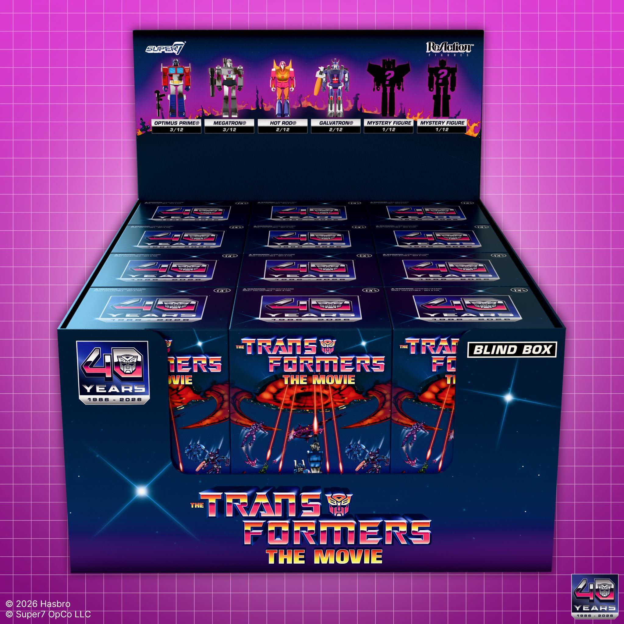 Transformers The Movie 40th Anniversary ReAction Blind Box retail display fully stocked with twelve individual blind boxes on pink grid background