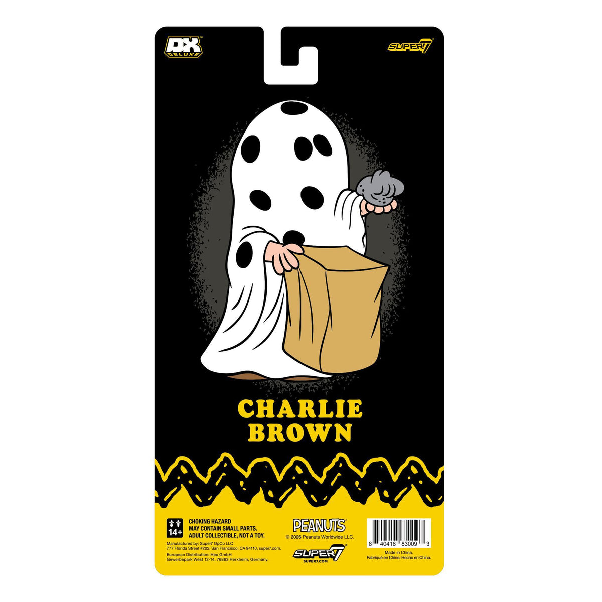 Charlie Brown wearing a ghost sheet on a black packaging card from Peanuts Deluxe Wave 01