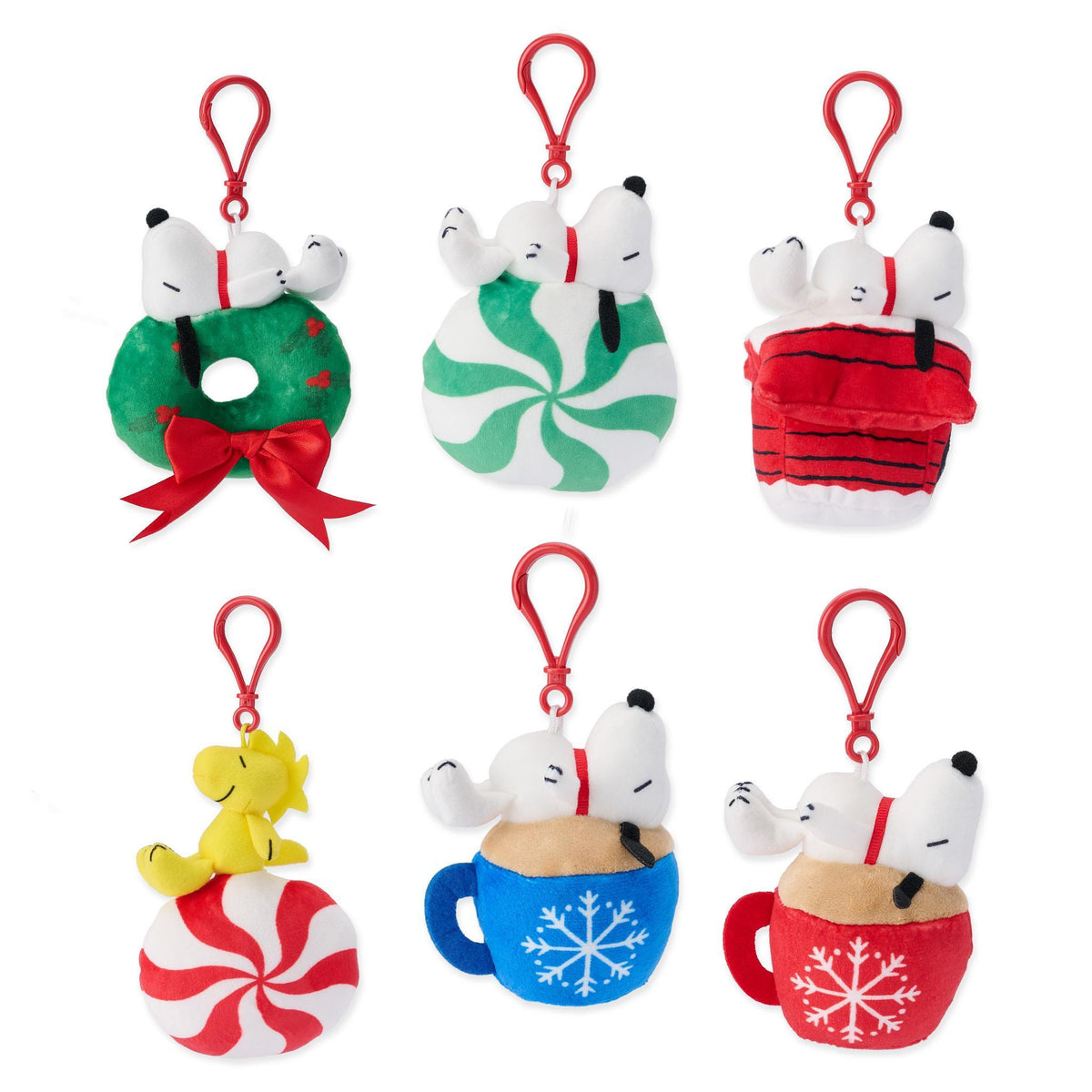 Six Peanuts holiday plush keychains of Snoopy and Woodstock