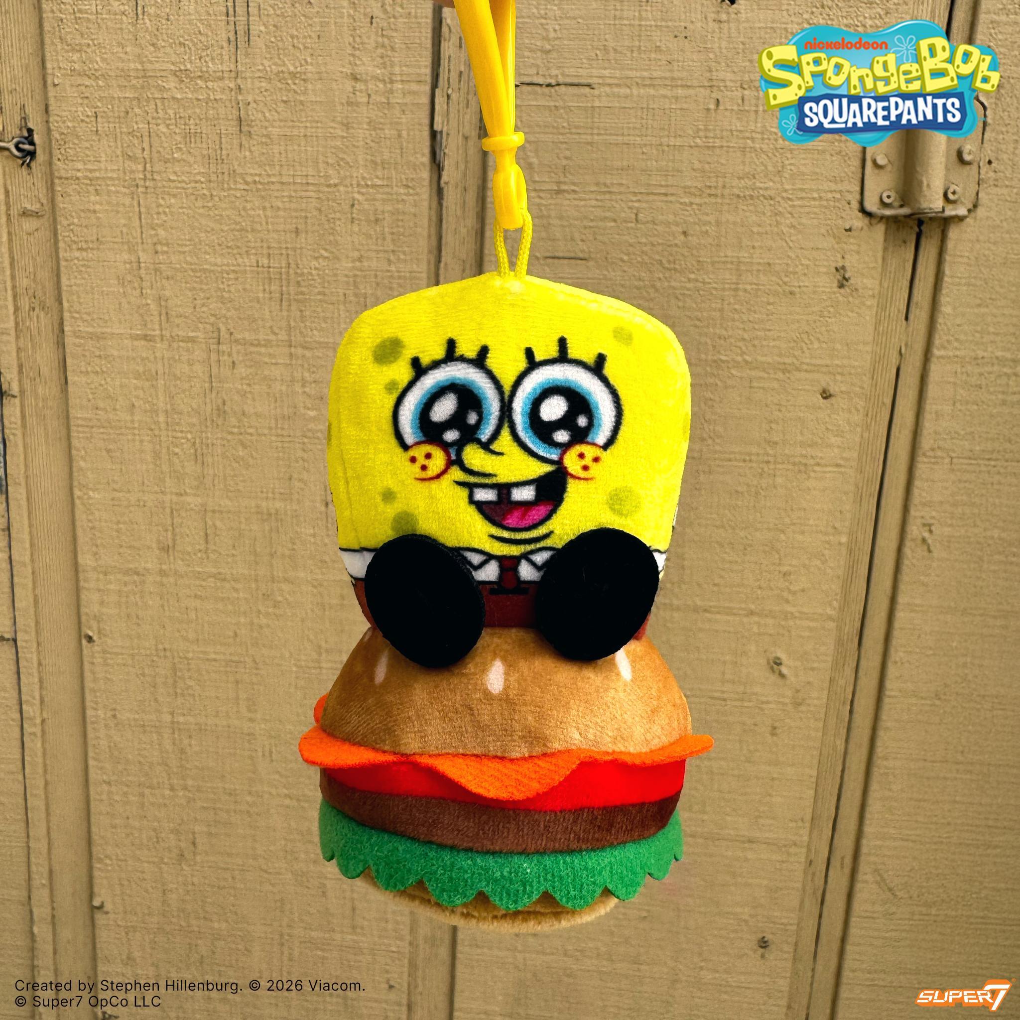 SpongeBob SquarePants Flat plush keychain sitting on a Krabby Patty