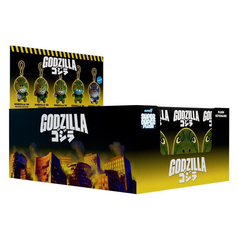 Godzilla plush blind box display Wave 01 with black to yellow gradient packaging and rows of tiny figures