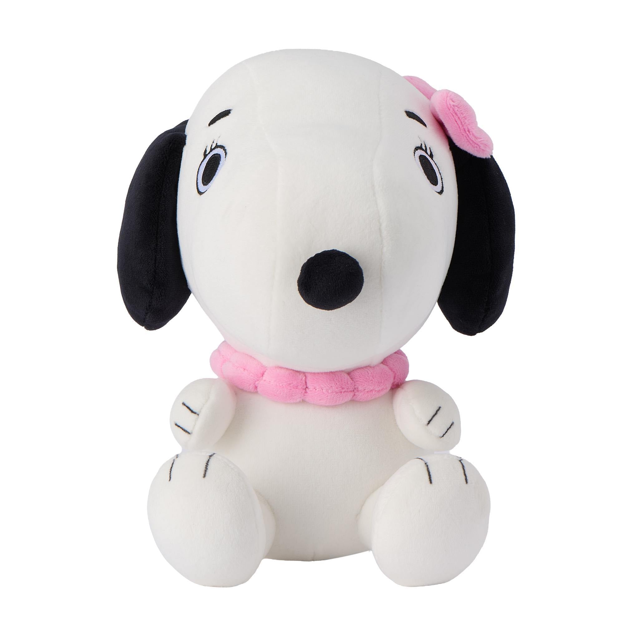 Profile view of Belle the Peanuts plush showing white fur and embroidered eye